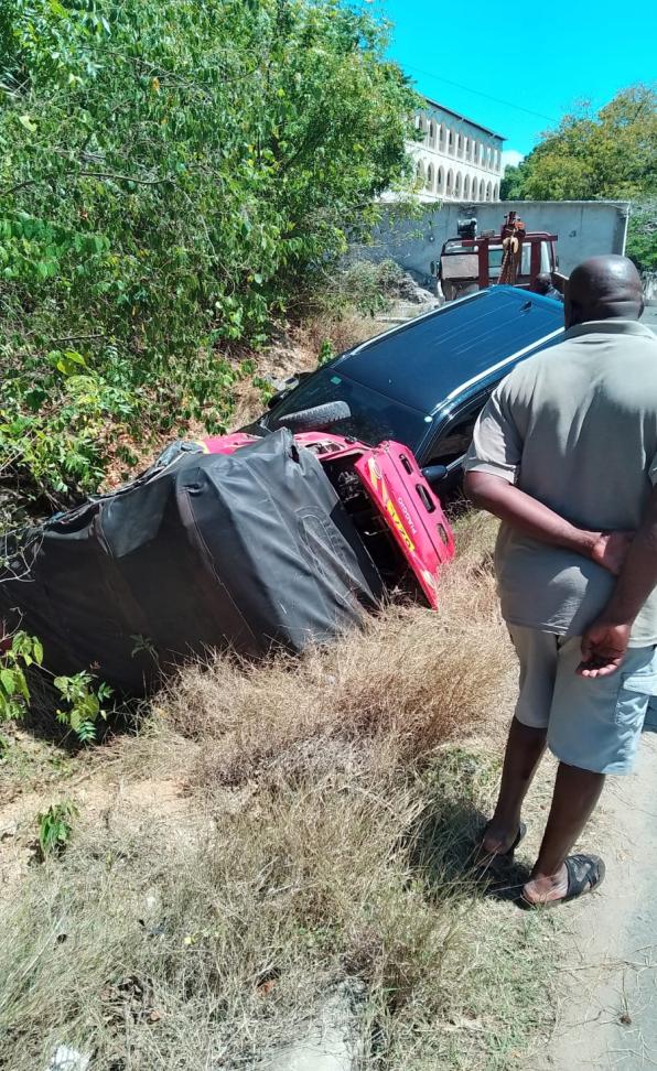 Overturned vehicle in a ditch beside the road at the Diani Beach Road junction near Lotfa Hotel