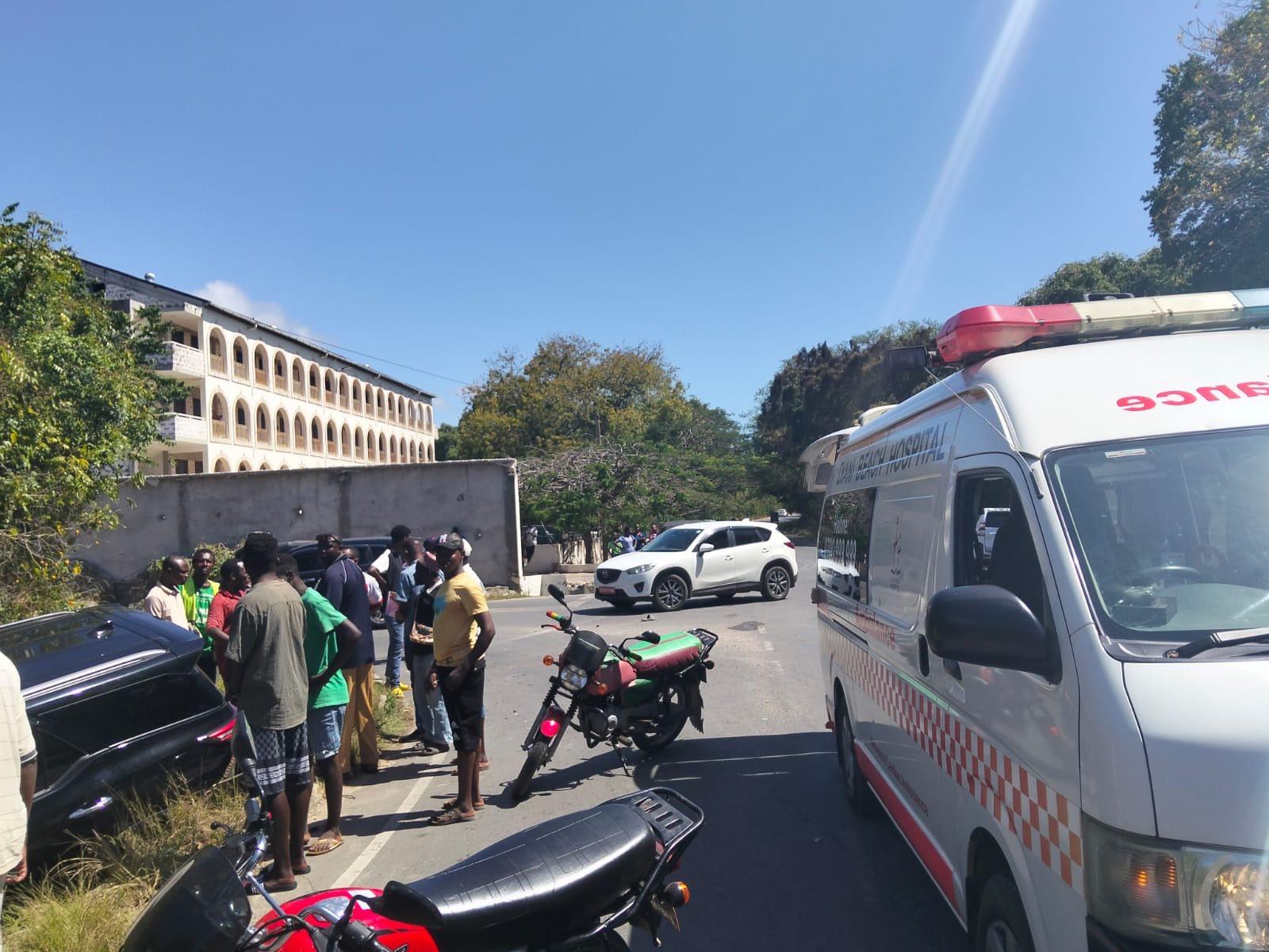 Ambulance and motorbike at the scene of a road accident at the Diani Beach Road junction
